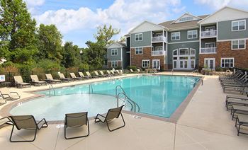 Sparkling pool w/sundeck and lounge chairs at the Haven at Reed Creek Martinez, GA